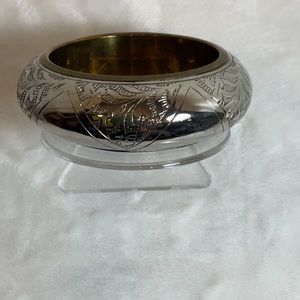 Stainless and brass, detailed etched dome bracelet.